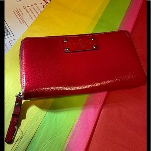 Kate Spade’s Vintage Red 100% Cow’s Leather Zip Around Wallet